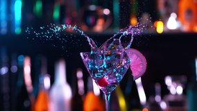 Camera Follows Ice cubes Falling into Glass of Fresh Fruit Cocktail in Bar. Super Slow Motion filmed on High Speed Cinema Camera. - Powered by Shutterstock - Get 15% off with code: PIKWIZARD15