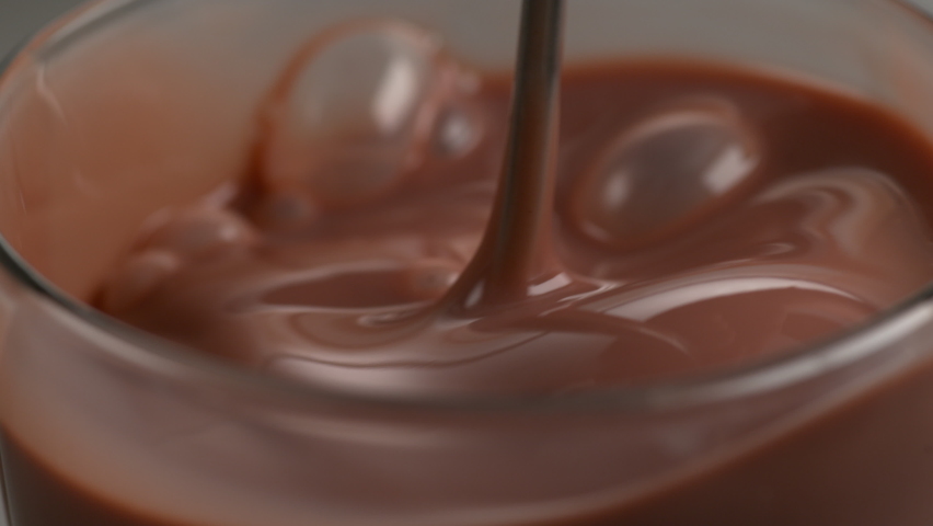 Pouring chocolate protien shake in slow motion. Royalty-Free Stock Footage #1065881998