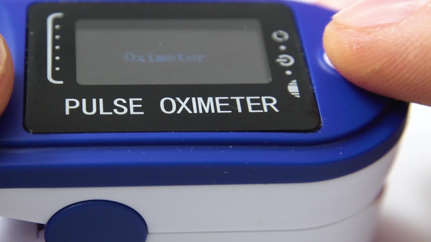 Macro view pulse oximeter on a mans finger. | Shutterstock HD Video #1065883486