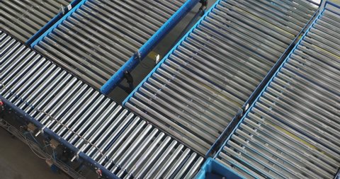 Transport Crates at Conveyor Rollers in Warehouse Top View
