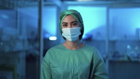 Female doctor move surgical face mask and smiling - Health care worker inside hospital - Powered by Shutterstock - Get 15% off with code: PIKWIZARD15