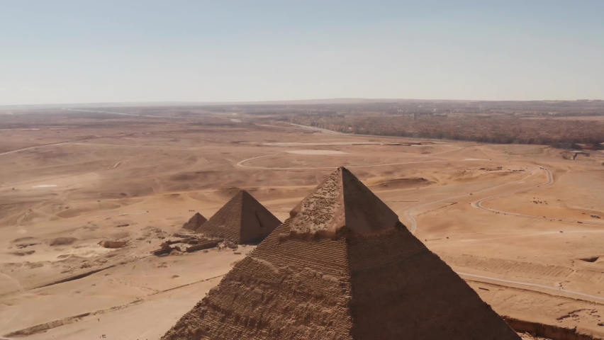 Landscape view of Pyramid of Khafre, and menkaure Giza pyramids landscape. historical egypt pyramids shot by drone. Royalty-Free Stock Footage #1065888745