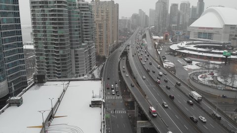 Toronto, ON, Canada. December 2, 2020: Aerial view of the Gardiner Expressway during a snowfall in Toronto