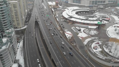 Toronto, ON, Canada. December 2, 2020: Aerial view of the Gardiner Expressway and the Roundhouse park during a snowfall in Toronto