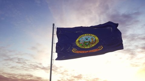 State flag of Idaho waving in the wind. Dramatic sky background. 4K
