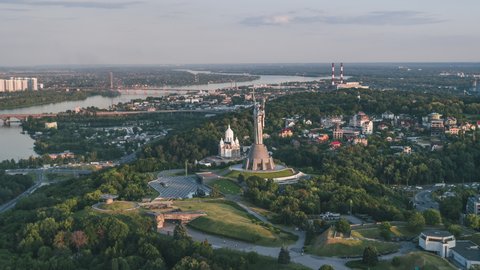 Kiev, Ukraine - circa 2019 - Establishing Aerial View Shot of Kyiv Kiev, glorious The Motherland Monument and river Dnieper, Ukraine