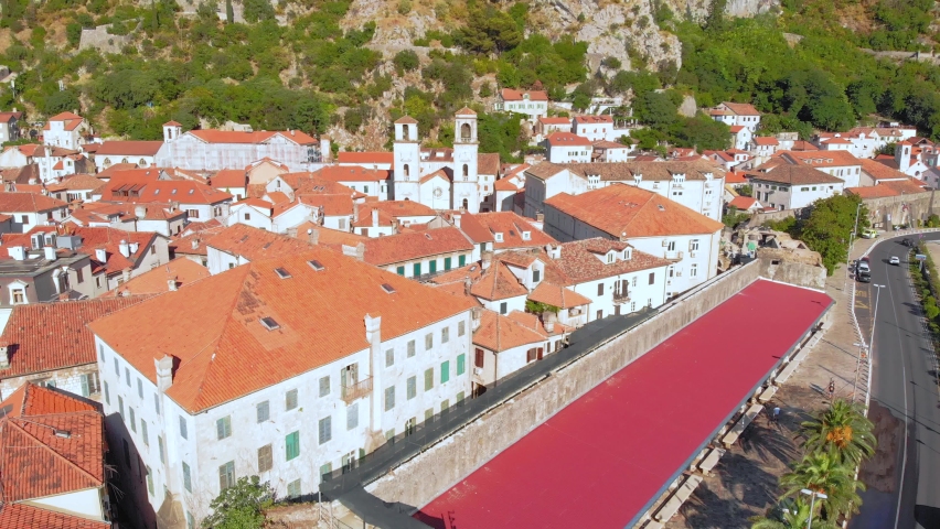 Old town Kotor, Montenegro on the coast of Kotor Bay of Adriatic sea. Old castles, ancient city walls. Drone footage