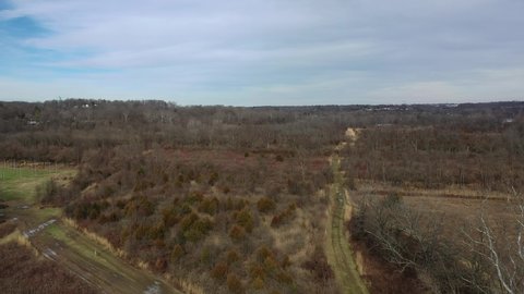 Aerial 4k footage shot of a nature preserve in the midwest during the winter. Dollying forward shot.
