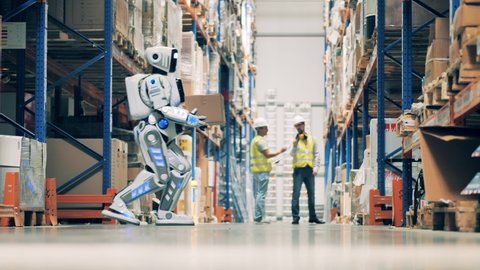 Warehouse robot is relocating boxes manually