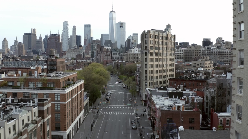 Aerial of empty streets of Manhattan during Covid-19 lockdown of 2020 - drone over 6th Avenue with no cars in traffic in New York City, NYC | Shutterstock HD Video #1065910507
