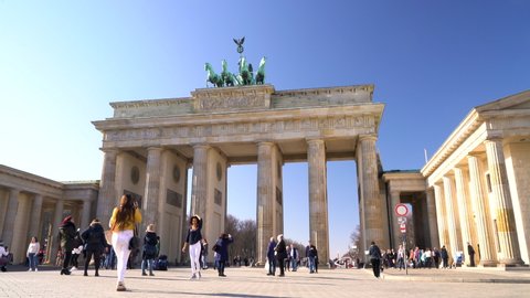 THE BRANDENBURG GATE, PARISER PLATZ, BERLIN, GERMANY – 18 FEBRUARY 2019, People, tourists and students during the day by The Brandenburg Gate, Pariser Platz, Berlin, Germany