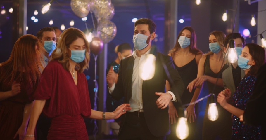 Multi-Ethnic People Company of Happy Coworkers Dancing into Music Celebrating Success Business Victory. Face Masks. SocialDistance. Coronavirus Quarantine. Royalty-Free Stock Footage #1065924775