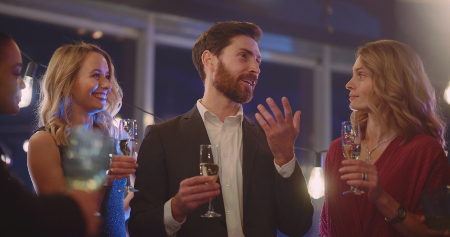 Caucasian handsome happy boss in company of colleagues making festive toast cheering champange drinks together having fun spending corporate party. Royalty-Free Stock Footage #1065924952