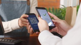 Customer using phone for payment at cafe restaurant, cashless technology and money transfer concept - Powered by Shutterstock - Get 15% off with code: PIKWIZARD15