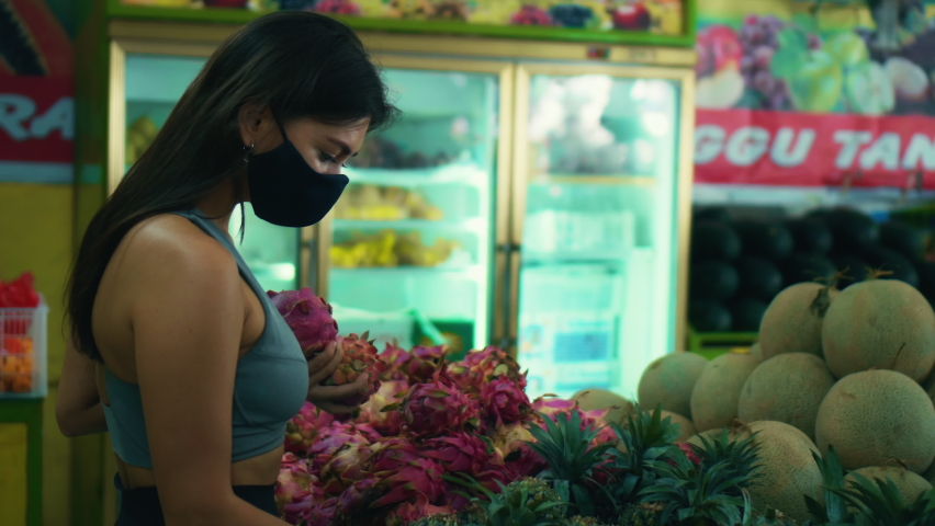 Yellow and green organic pineapples lying on the counter of a street store in Indonesia