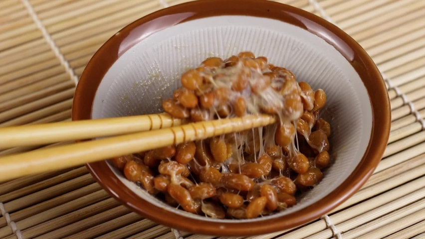 Sticky and stringy Natto. Healthy Traditional Japanese food made of fermented soybeans.  Royalty-Free Stock Footage #1065952201