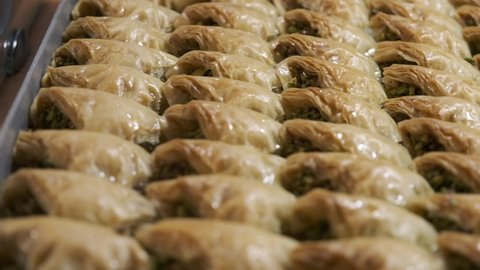 Baklava, a traditional Turkish dessert, is served on a tray.