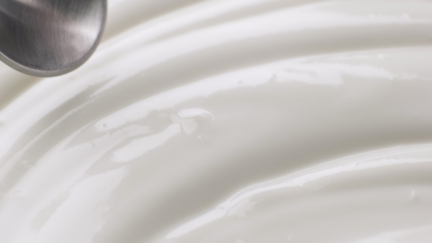 Sour cream with spoon, fresh greek yogurt close up Royalty-Free Stock Footage #1065967348