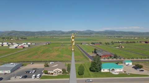 Afton , Wyoming , United States - 07 07 2020: Close up aerial view of Angel Moroni on the Star Valley Temple of the Mormon Church