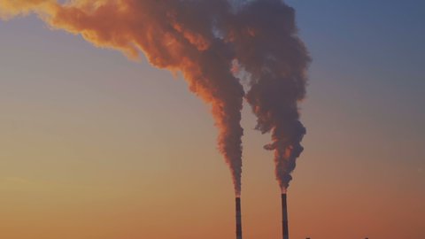 Environmental pollution. Climate change. Factory chimneys emit harmful substances into air