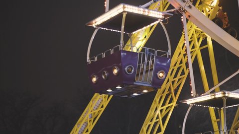 Ferris wheel at night in an amusement park. No people due to quarantine in Odessa amusement park