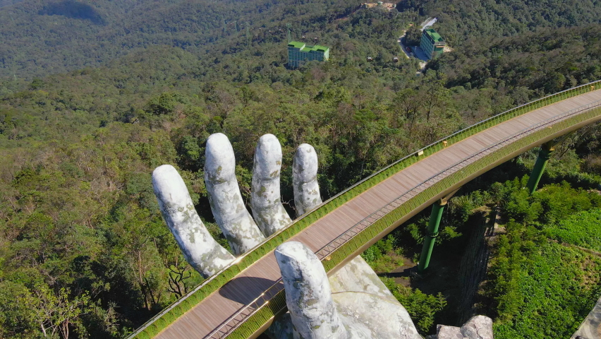 Aerial shot of the Golden Bridge in the city of Danang. Tourist destination in central Vietnam. Travel to Vietnam concept