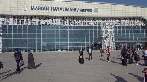 Mardin, Turkey - October 2019: Mardin Airport signage on building exterior with passengers arriving to Mardin
