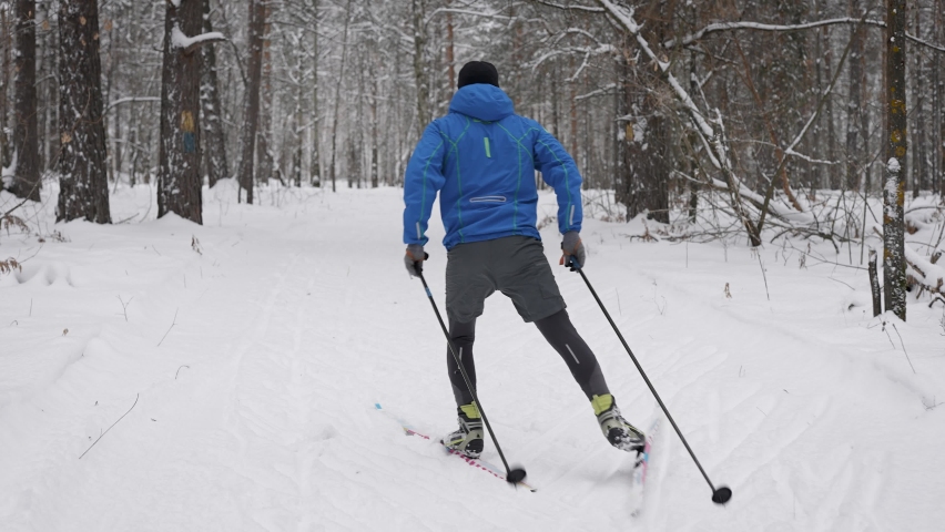 Cross-country skiing winter training. The athlete develops good speed. Royalty-Free Stock Footage #1065990181
