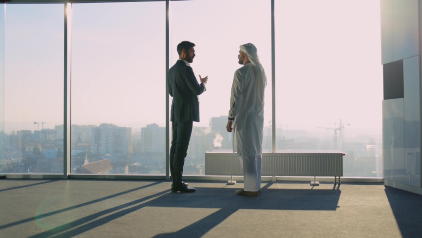 Diverse Biusiness Couple of Arab Rich Businessman Talking with Office Manager Shaking Hands Discussing Agreement for Investment. Muslim Investor. Cooperation. Royalty-Free Stock Footage #1065995596