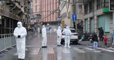 Shanghai.China-Jan.2021: new Covid-19 cases have emerged in China. Region has been locked down. Medical staff in white hazmat suit on street