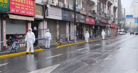 Shanghai.China-Jan.2021: new Covid-19 cases have emerged in China. Region has been locked down. Medical staff in white hazmat suit on street