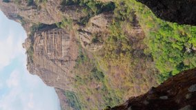 VERTICAL VIDEO of the Tepoztlan Mountains through another mountains