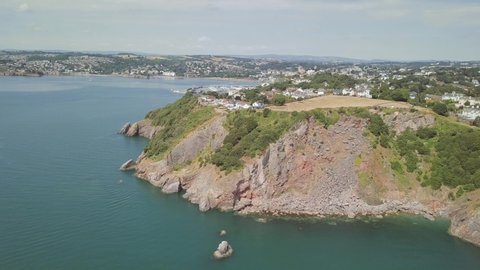 Aerial drone footage of the beautiful calm seaside port town of Torquay in Devon, England,