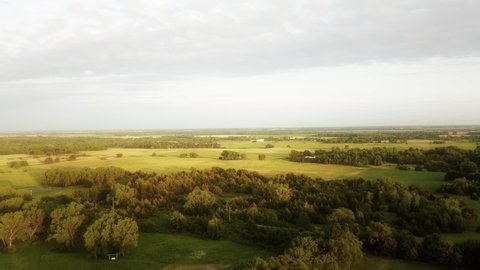 Aerial rising over Kansas farmland in the summertime