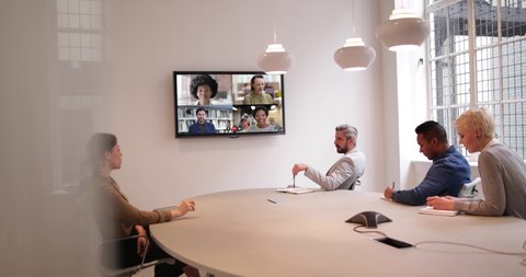 Business people video call from office boardroom with team working from home and abroad
