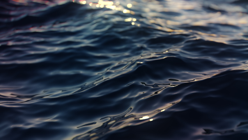 Water waves detail, colorful Ocean sea texture, shining golden waves. Dramatic climate change top view close up, seamless loop 3d. | Shutterstock HD Video #1066074355
