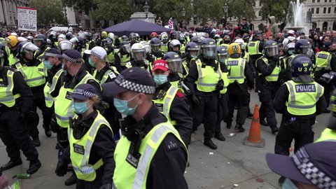 London , United Kingdom (UK) - 09 26 2020: Riot police remove PA system and an arrested person on Coronavirus conspiracy protest