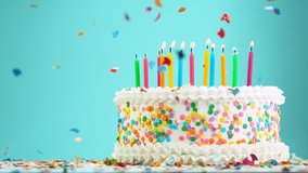 Birthday Cake With Burning Colorful Candles on Pastel Blue Background. Super Slow Motion, 1000 FPS. - Powered by Shutterstock - Get 15% off with code: PIKWIZARD15