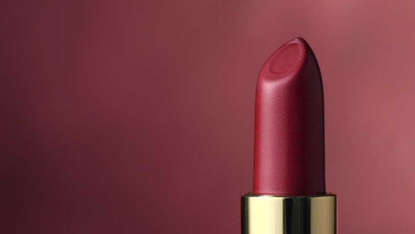 closeup of red rotating luxury lipstick Royalty-Free Stock Footage #1066093501