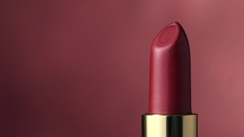 closeup of red rotating luxury lipstick