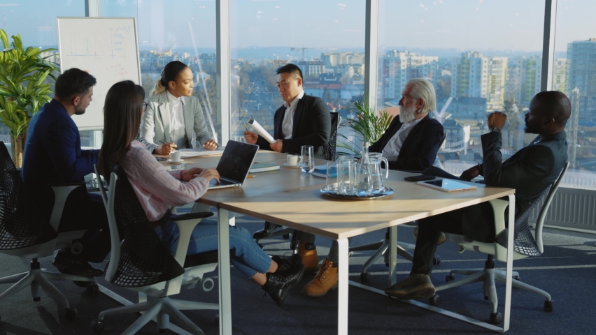 Interracial business staff engaged in corporate meeting. Company colleagues coolabgorating in boardroom brainstroming solving issues together. Teamwork. | Shutterstock HD Video #1066102456