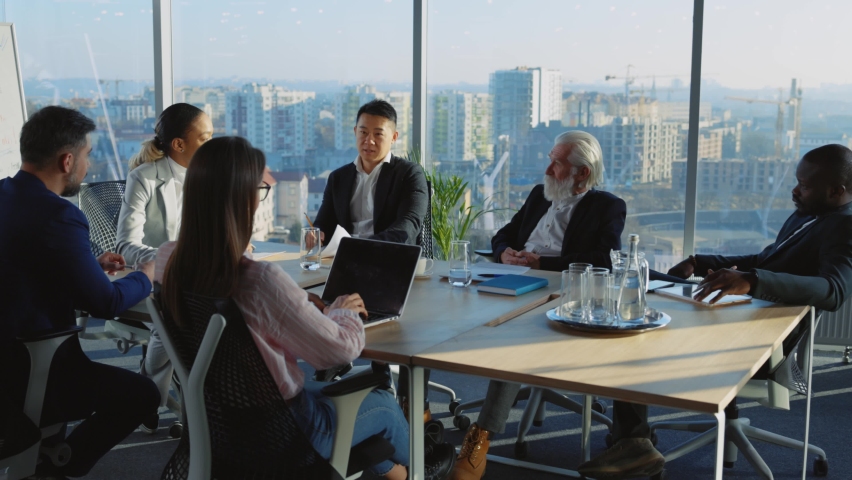 International group of business parnters gathering for office boardroom meeting negotiating corporate plans for future. Marketing lecture. Meeting. Royalty-Free Stock Footage #1066102477