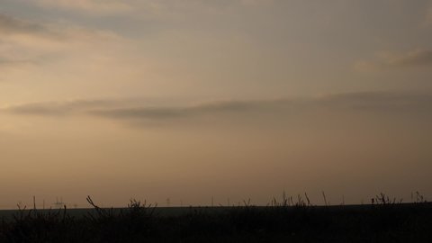 Wind turbines silhouette at sunset 