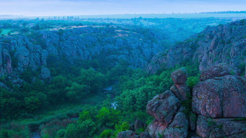 Cloudy Dawn with a Fog over the Rock Canyon. Time Lapse. 4K. 