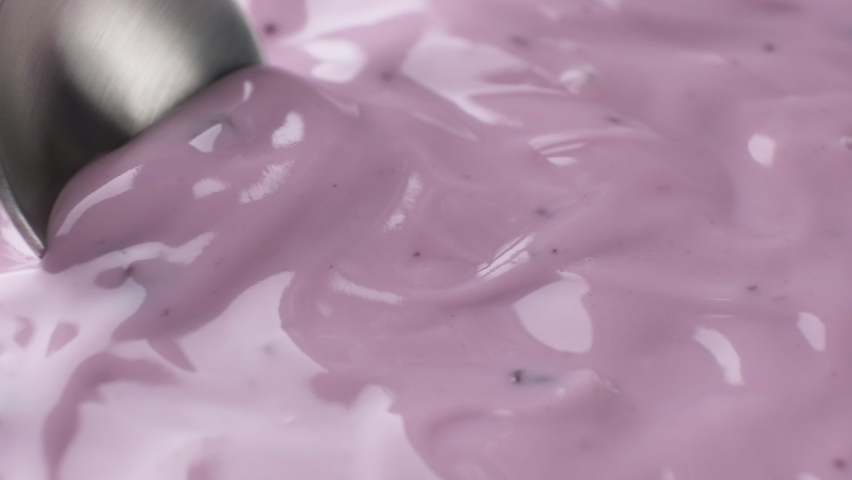 Fresh berry yogurt with spoon, blueberry yogurt close up Royalty-Free Stock Footage #1066128784