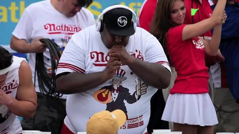 NEW YORK CITY - JULY 4 2015: Nathan's Famous staged it annual fourth of July hot dog eating contest in Coney Island, Brooklyn. Eric "Badlands" Booker competes