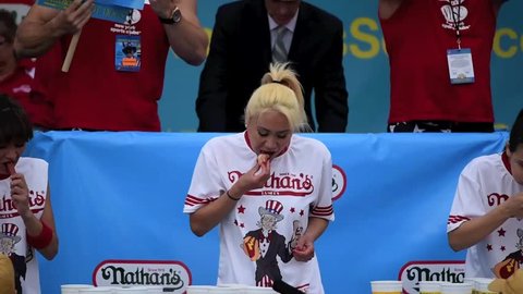 NEW YORK CITY - JULY 4 2015: Nathan's Famous staged it annual fourth of July hot dog eating contest in Coney Island, Brooklyn. Reigning champion Miki Sudo competes to win another title