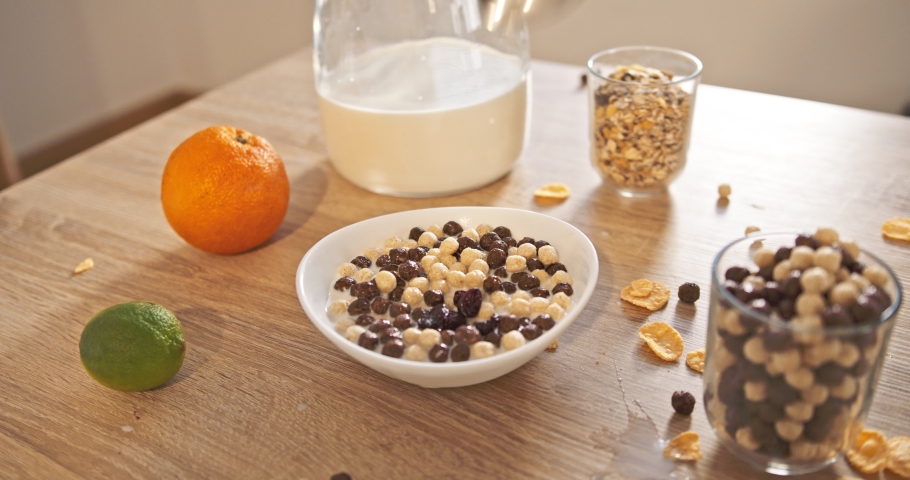 Breakfast Cereal Food and milk Being Poured Into Bowl