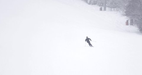 Footage of a skier skiing down a hill