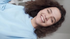 Happy hispanic gen z teen girl dancing shooting social media video on phone. Funny young woman blogger recording content for online channel mobile app. Smartphone cam view, vertical video. - Powered by Shutterstock - Get 15% off with code: PIKWIZARD15